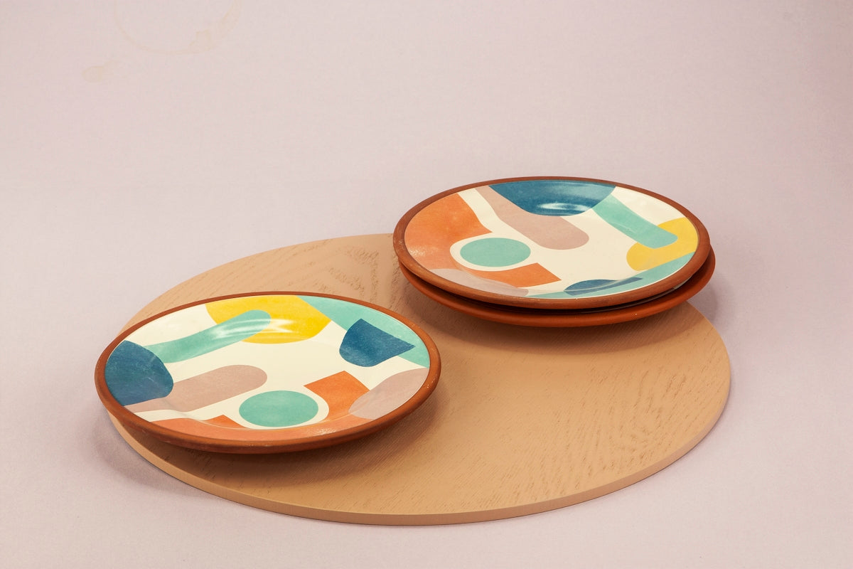 2 round brown wooden plates