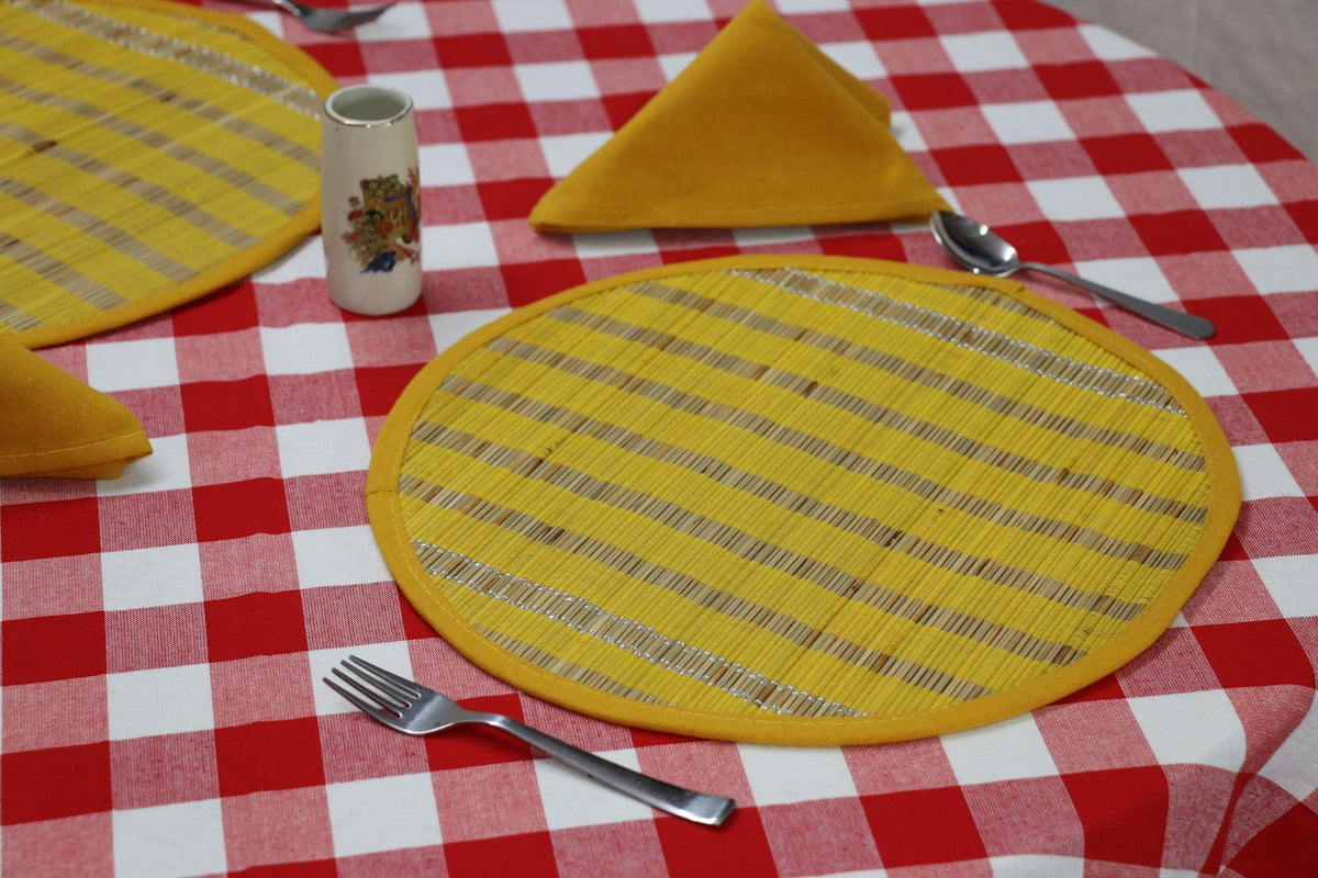 a plate with a yellow circle on it and a fork on it