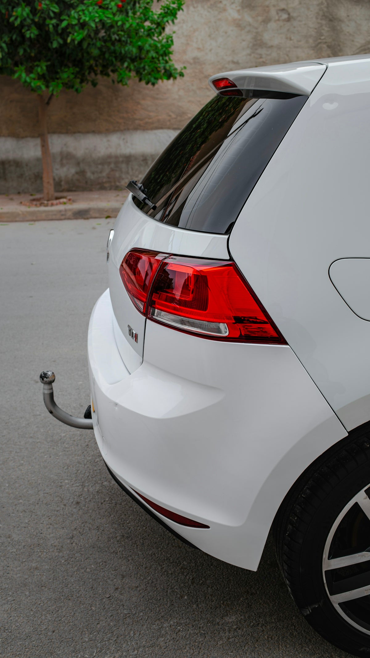 a white car parked on the side of the road