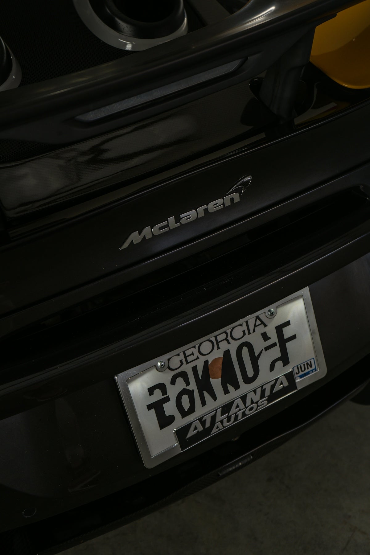 A close up of a license plate on a car