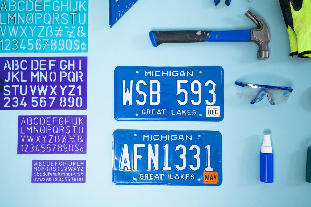 Michigan license plates and alphabet stencils on wall