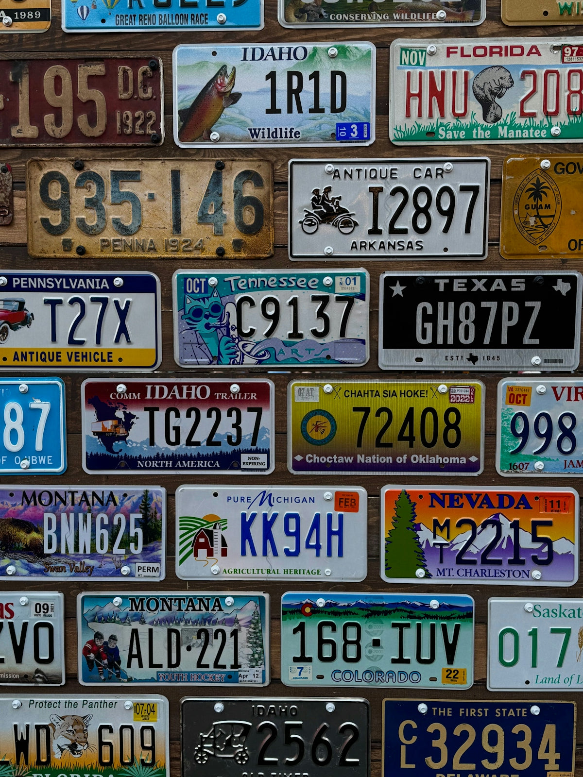 Collection of various license plates from different states.