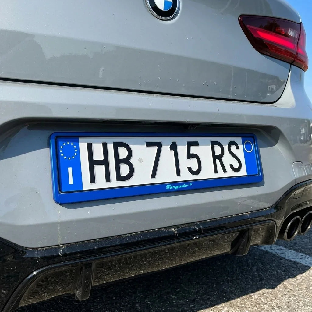 Blue Targado license plate holder on a grey BMW car