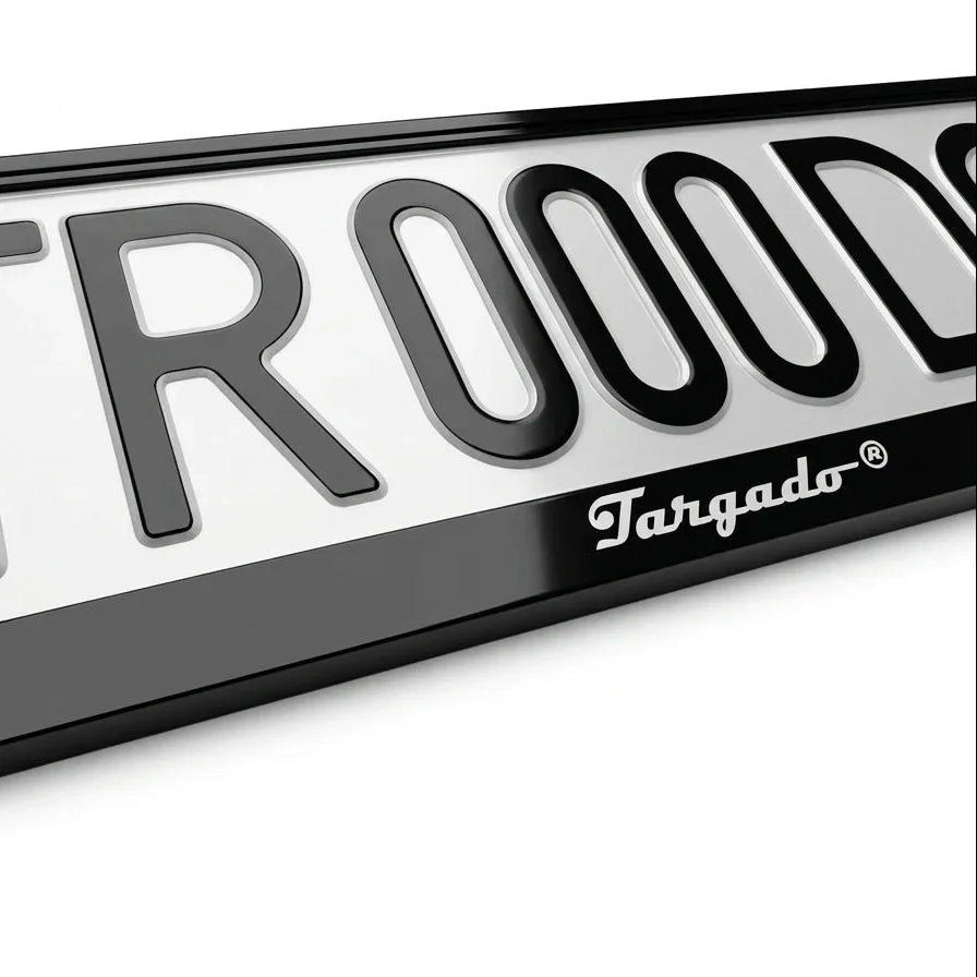 Close-up of the Model Mamba white license plate frame by Targado Srl with black lettering.