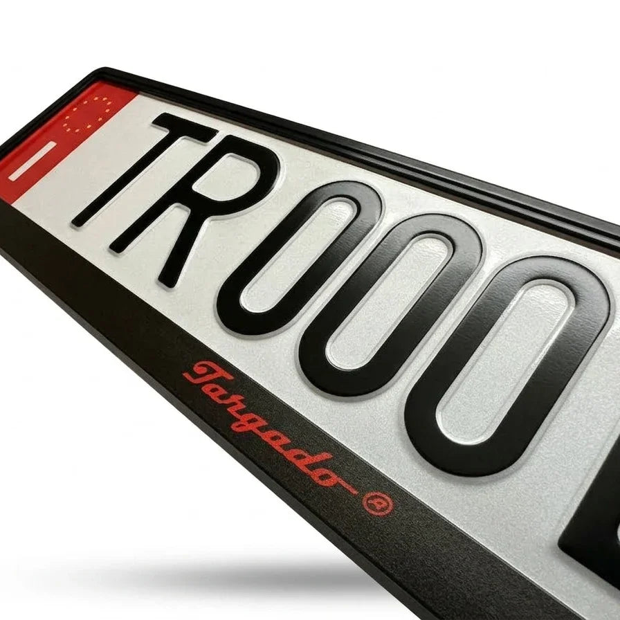 Close-up of a Targado Srl Model Mamba license plate holder with red logo and black frame.