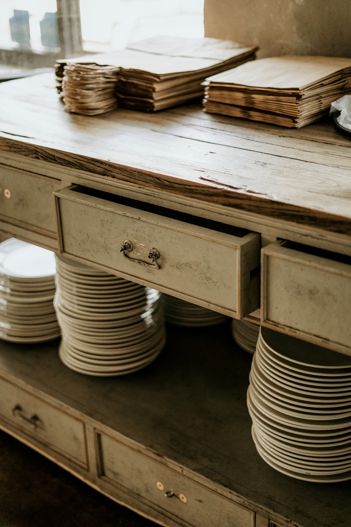 a table with plates stacked on top of it