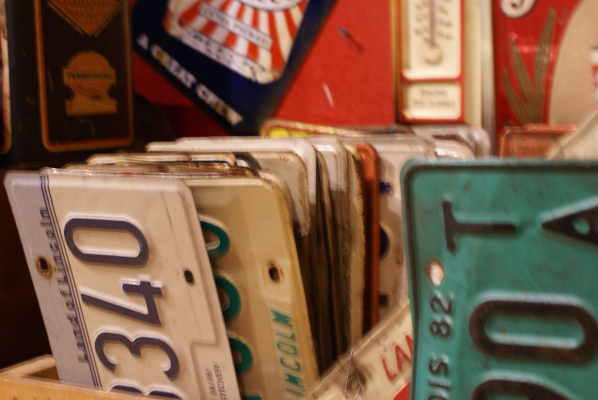 a number of license plates on display in a store