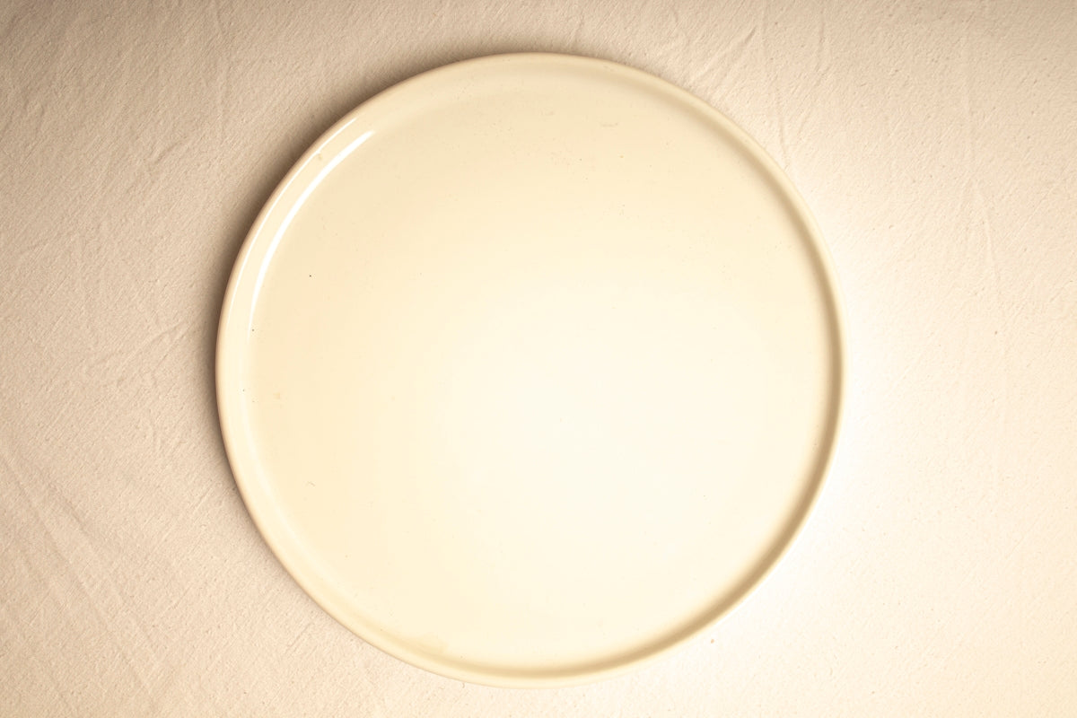 A white plate sitting on top of a table