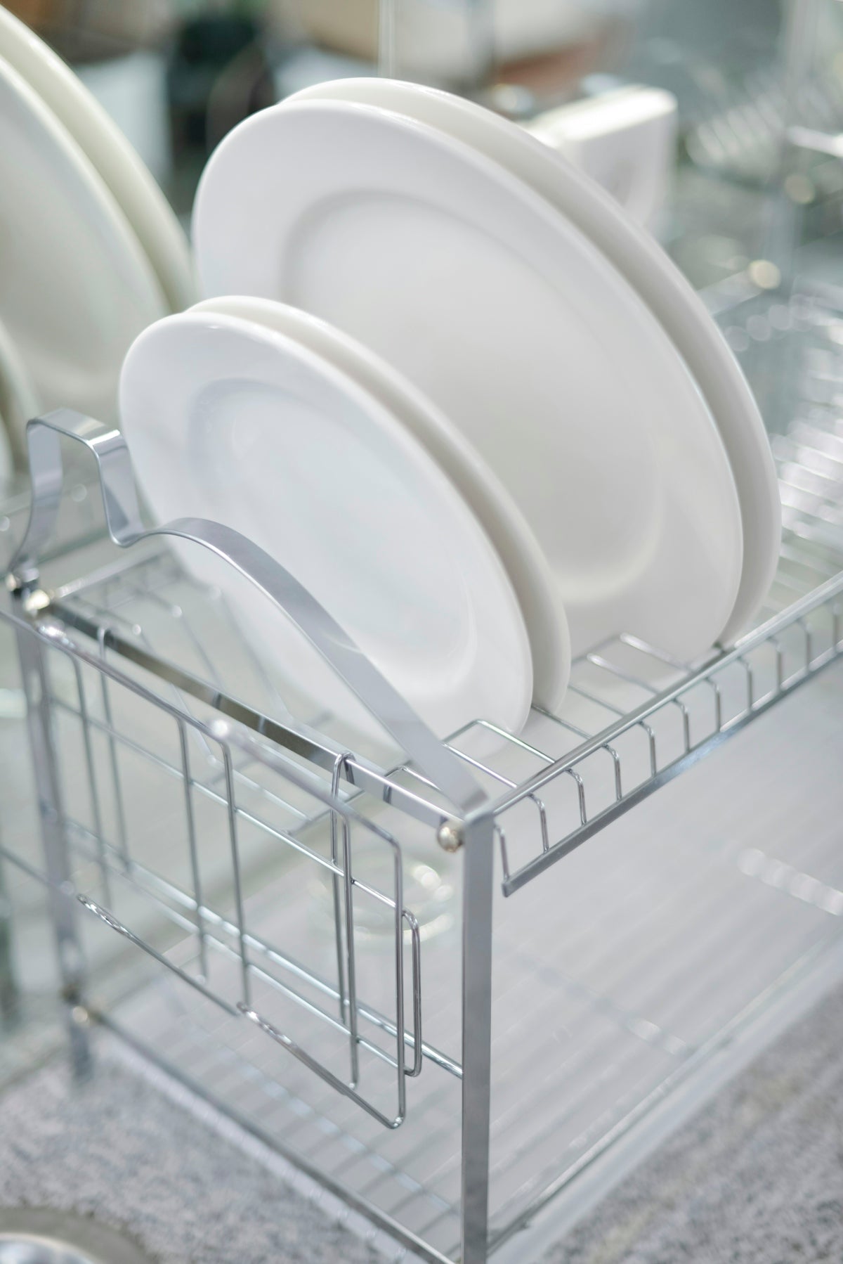A rack with plates and cups in it