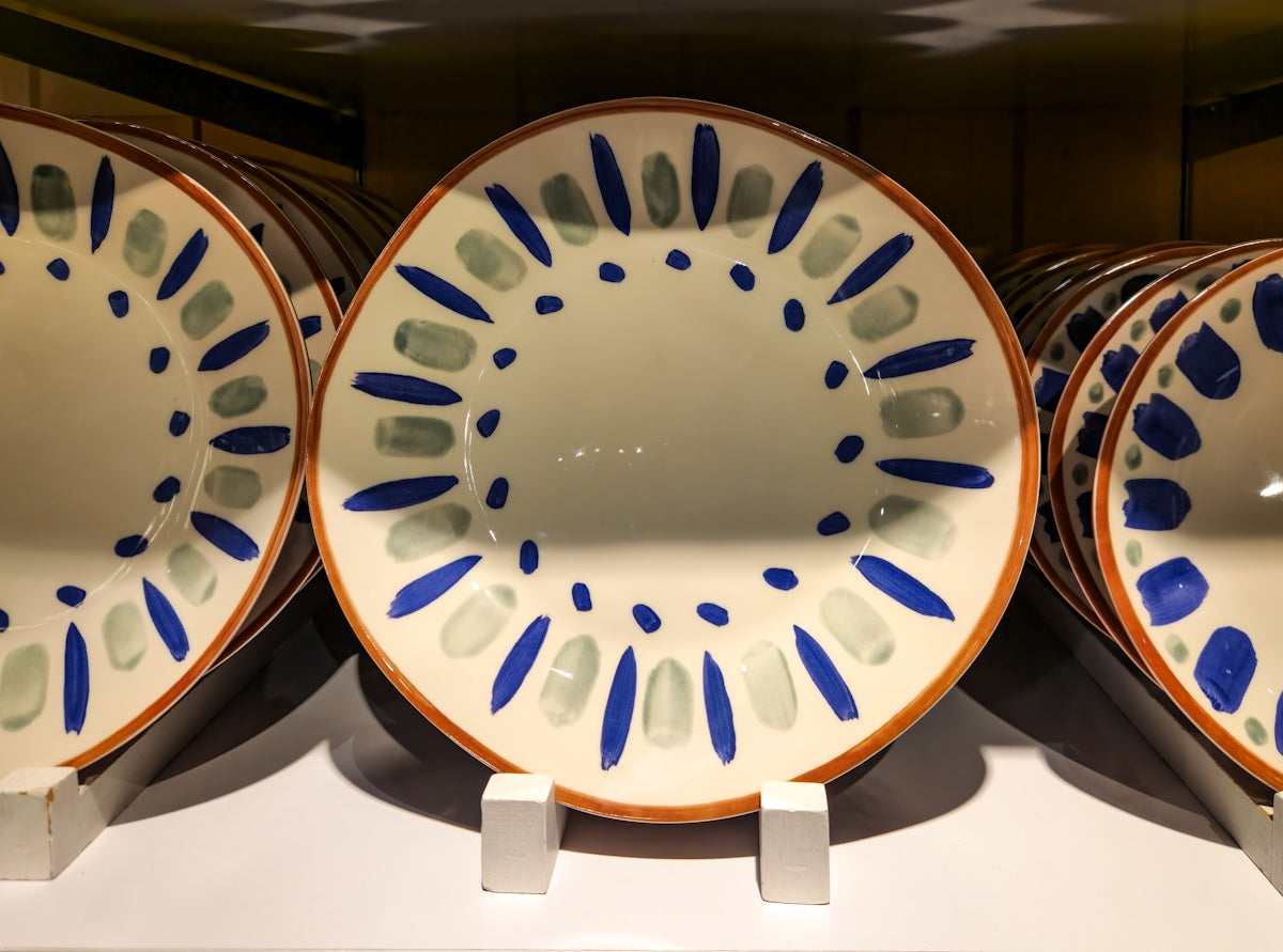 A group of three plates sitting on top of a counter