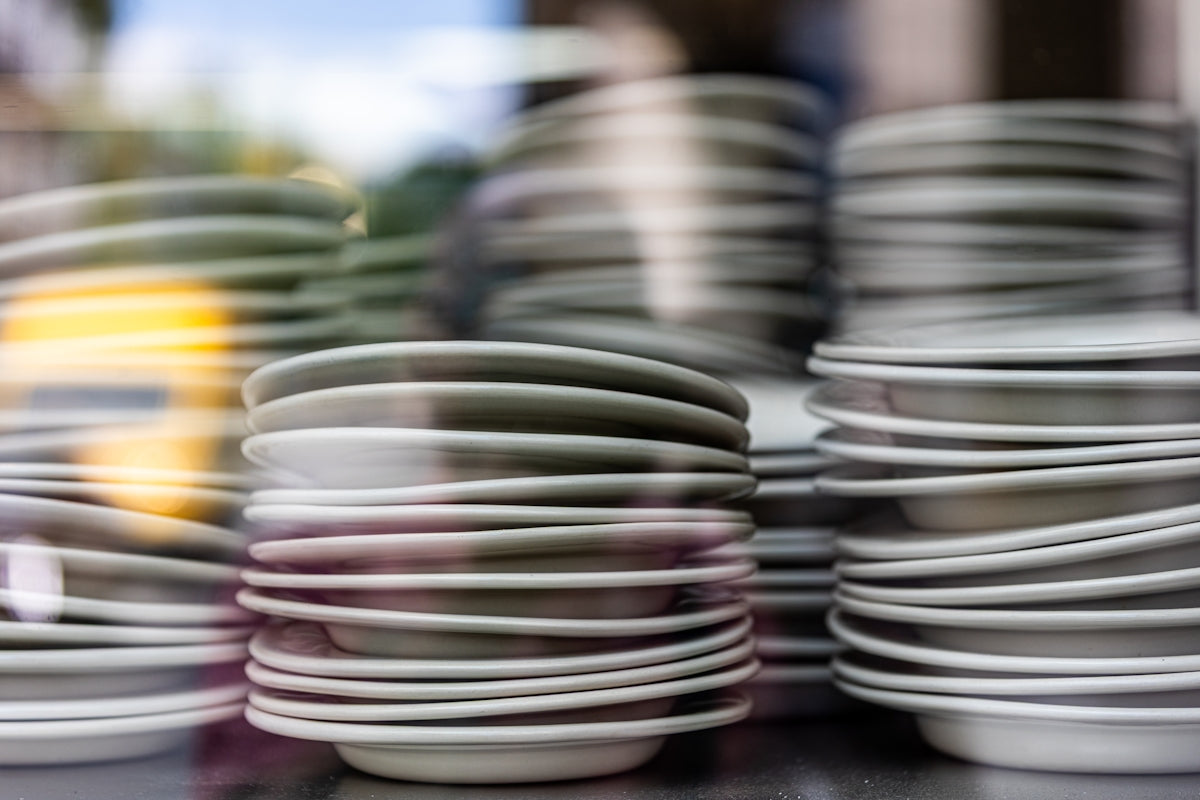Stacks of clean plates are ready for use.
