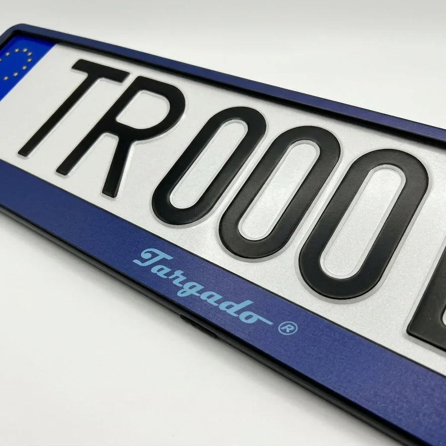 Close-up of a blue Targado Srl license plate holder with a custom white plate.